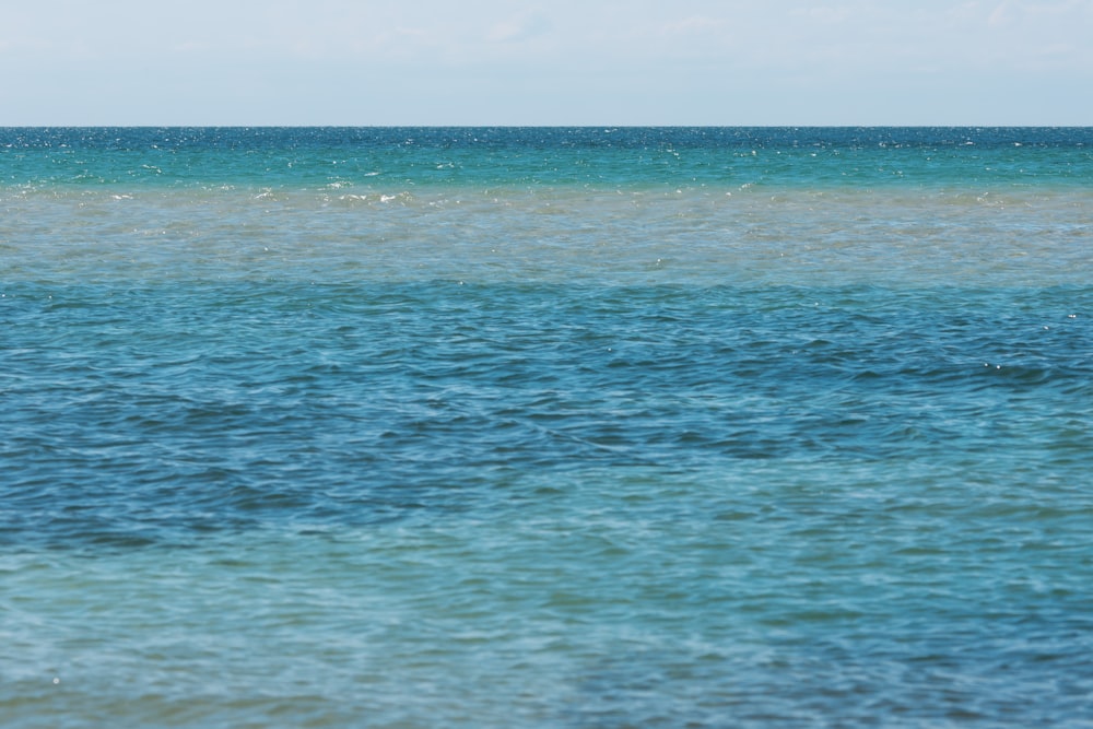 blue sea under blue sky during daytime