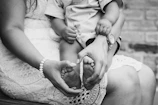 grayscale photo of woman holding baby