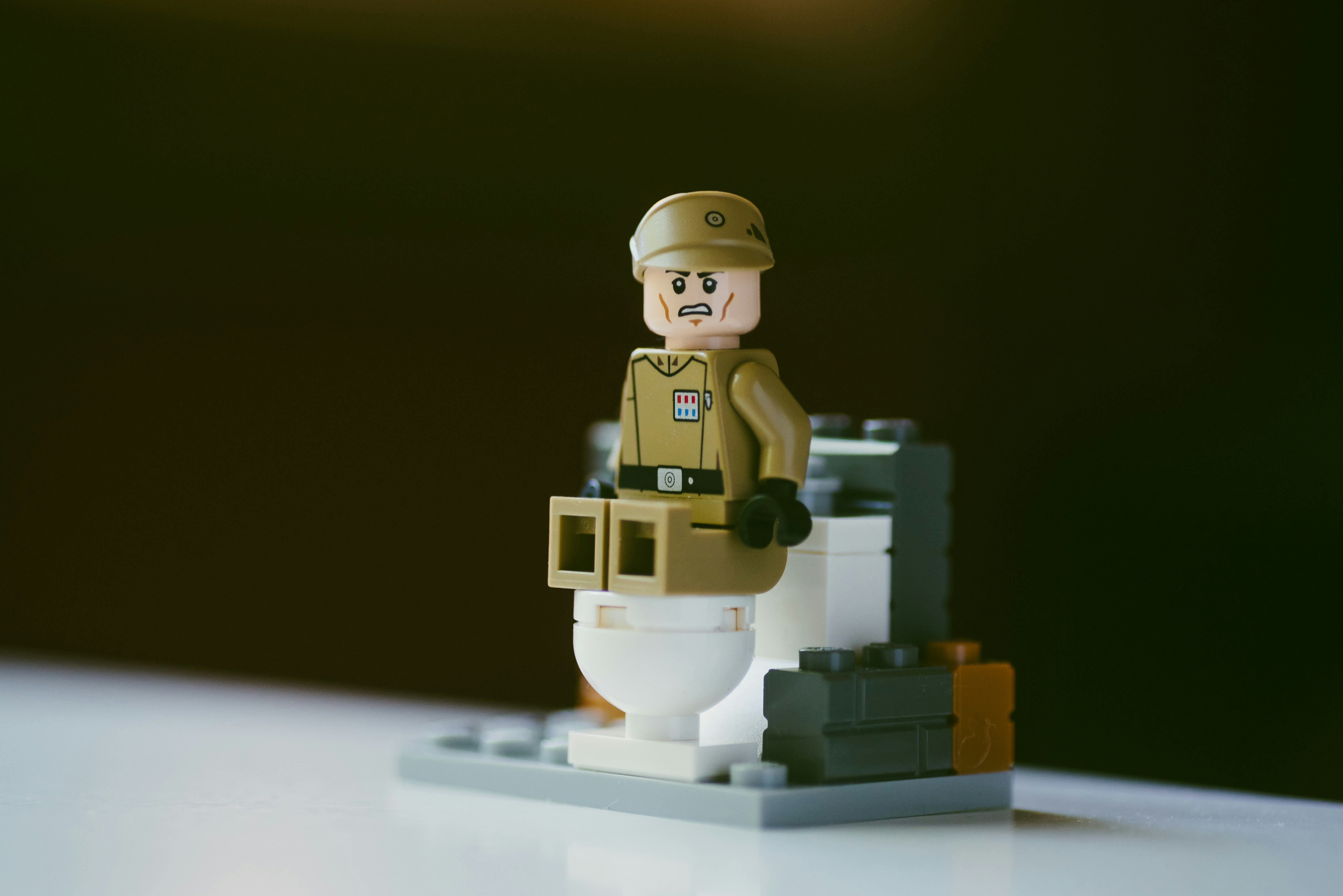 lego minifig on white table