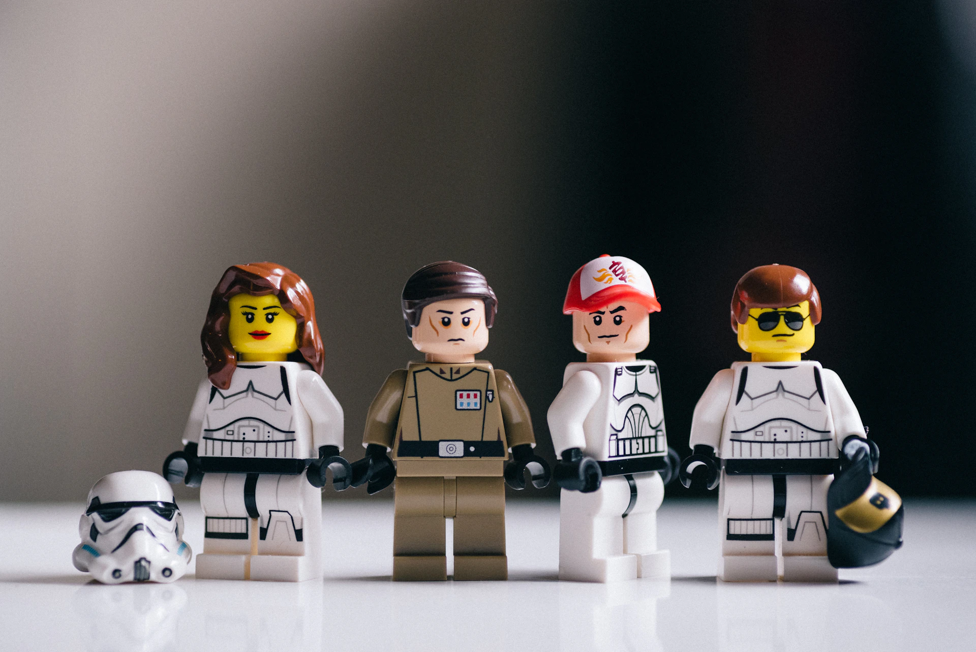 3 lego toys on white table