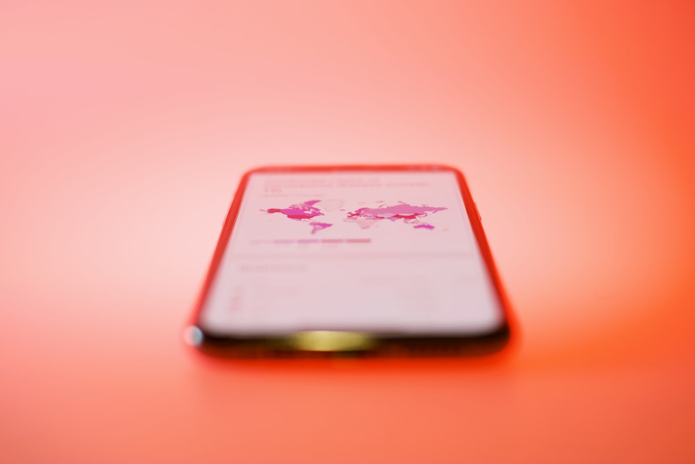 white and red card on brown wooden table