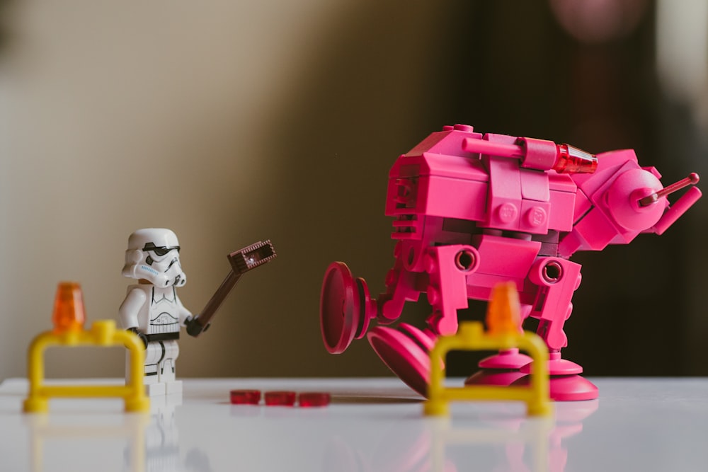 pink and yellow lego toy