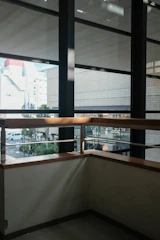 Modern aluminum door and window installation in a sleek black and gold themed home interior.