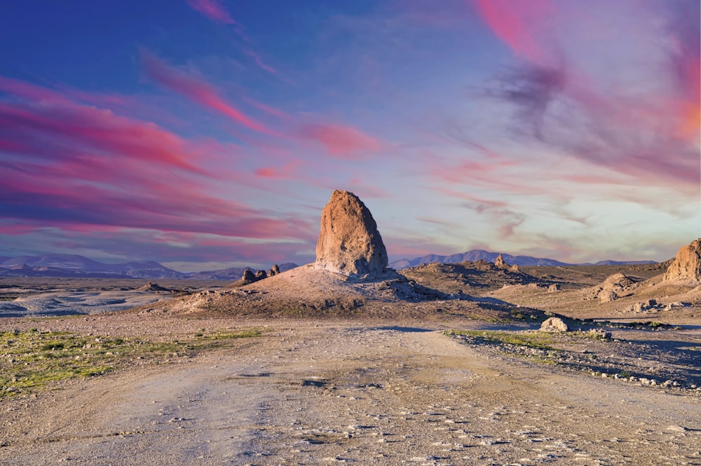 brown rock formation under blue sky