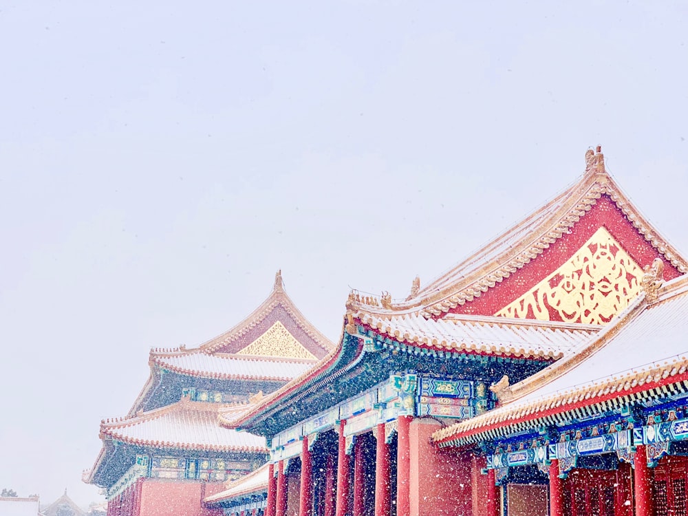 red and white temple under white sky during daytime