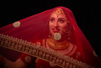 woman in red hijab with gold crown