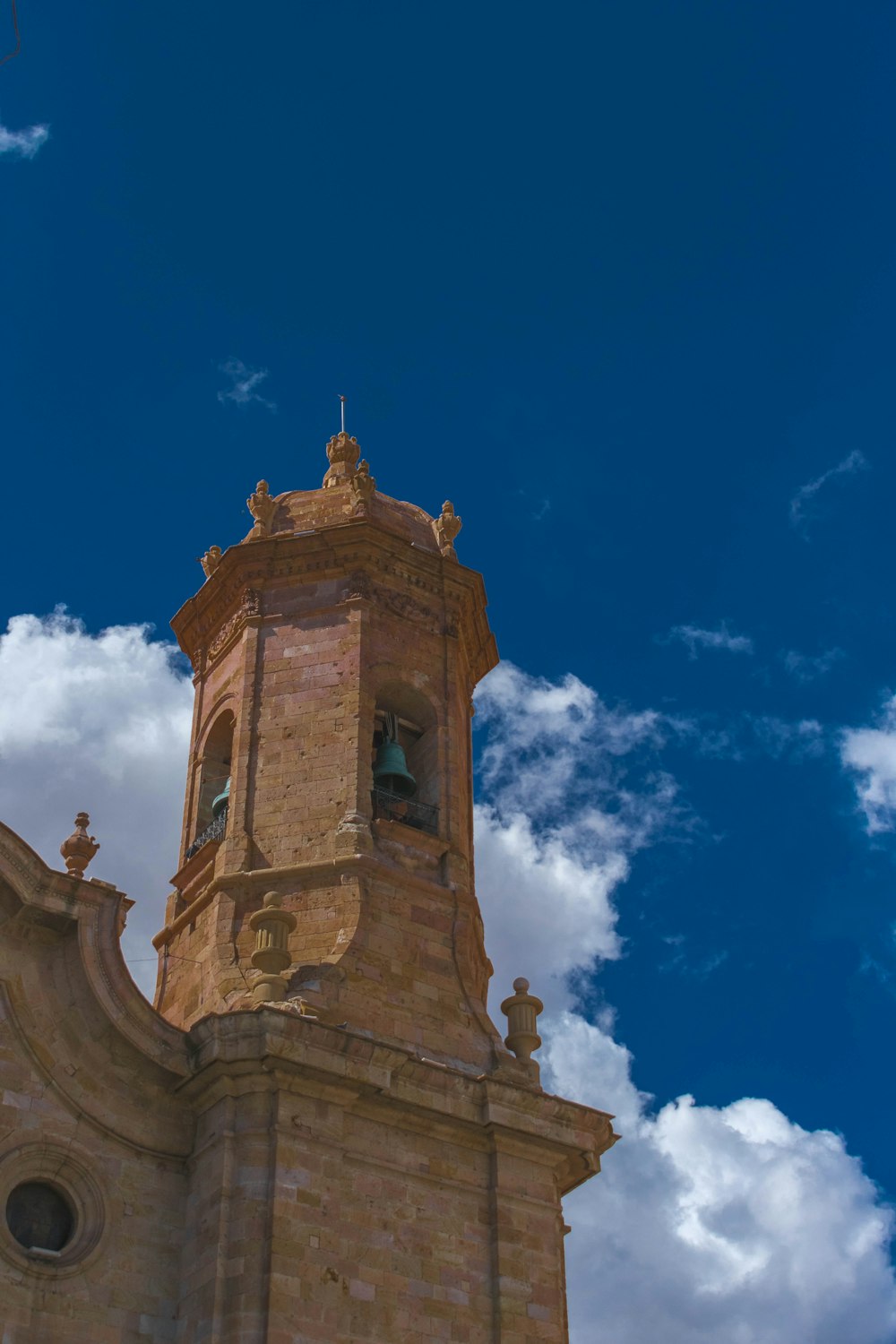 brown concrete building under blue sky during daytime