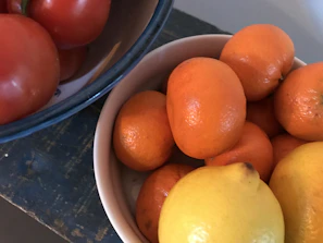 Close-up of a colorful bowl filled with fresh fruits and vegetables.