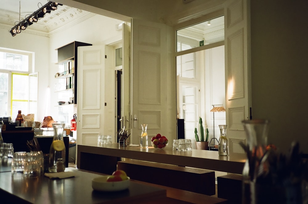 white wooden kitchen cabinet near white wooden door