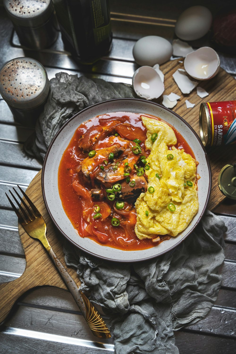 cooked food on round ceramic bowl beside stainless steel fork and knife