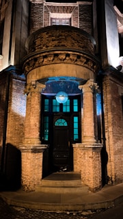 A classic Masonic lodge entrance with symbolic pillars and soft morning light.