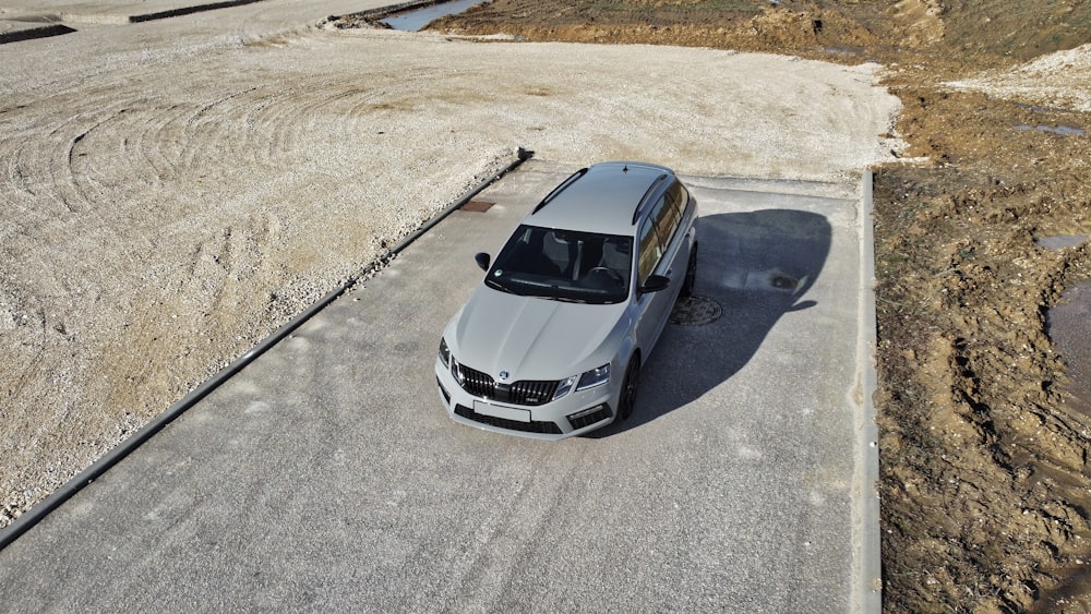 white and black bmw m 3 on gray asphalt road during daytime