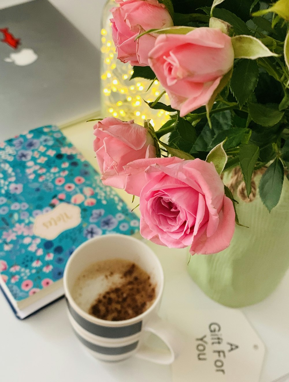 pink rose on white ceramic mug