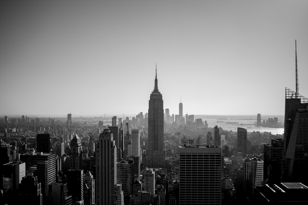 grayscale photo of city buildings