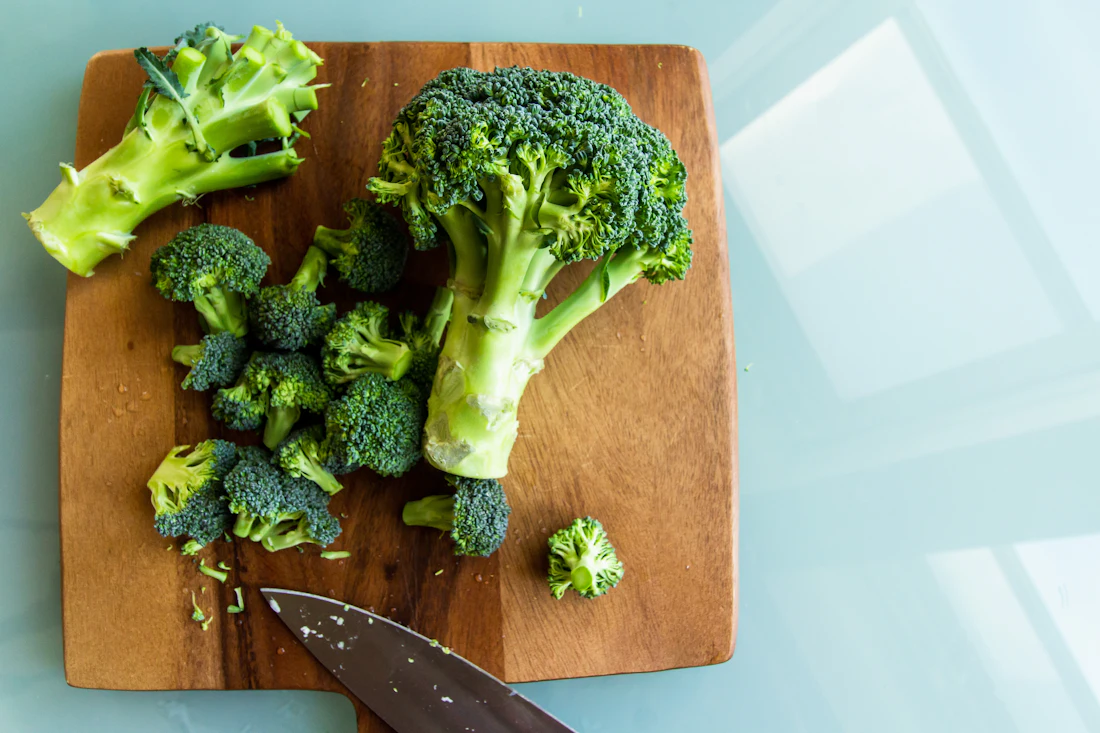 Fresh broccoli on a wooden chopping board