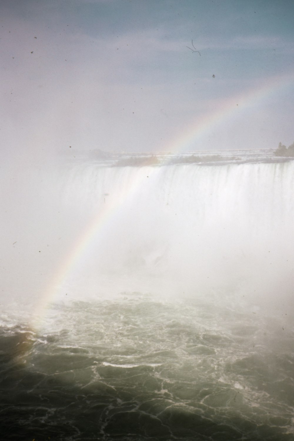 water falls on brown field during daytime