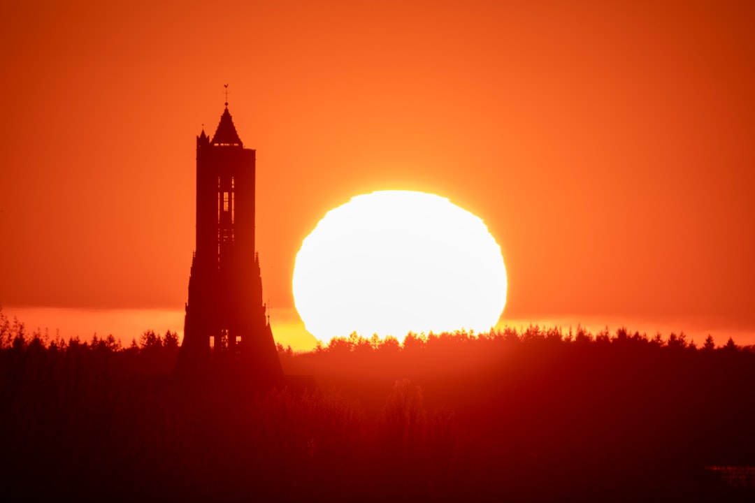 silhouette of building during sunset