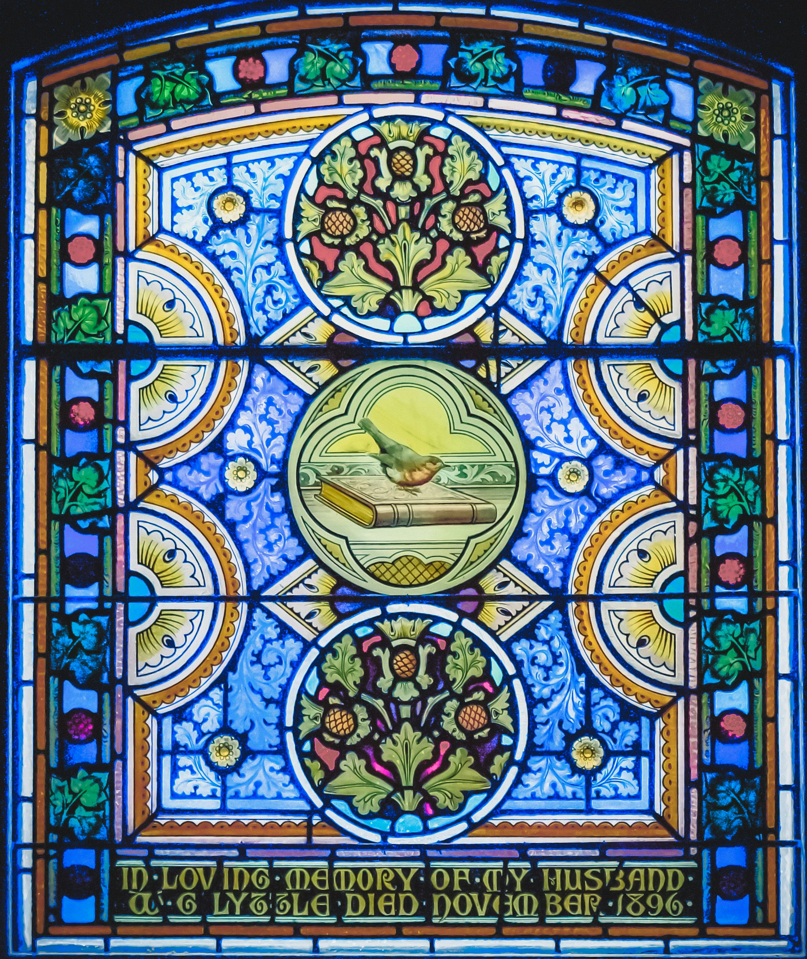 Stained-glass window in the First Presbyterian Church memorializing the death Mr. Lyzzle in 1896.