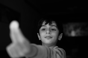 grayscale photo of boy in crew neck shirt