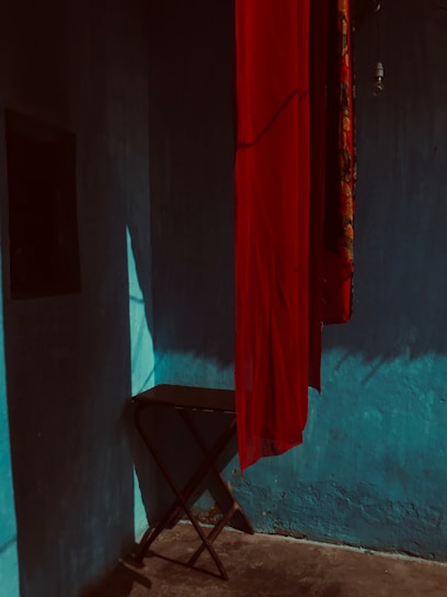 A folding table neatly tucked away against a wall, showcasing its space-saving design.