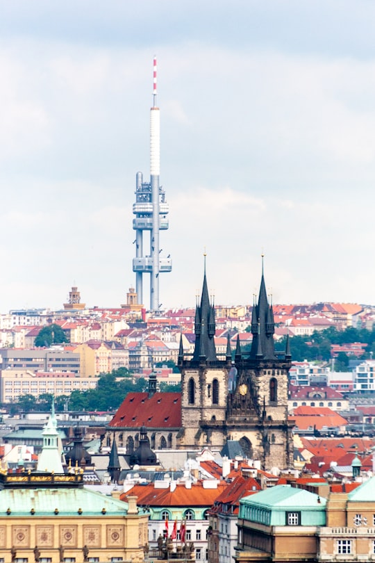 brown and white concrete building under white sky during daytime in Old Town Square Czech Republic