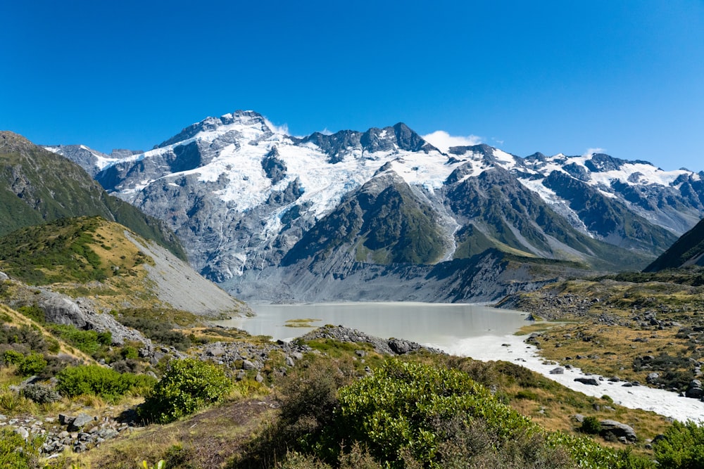 snow covered mountain under blue sky during daytime