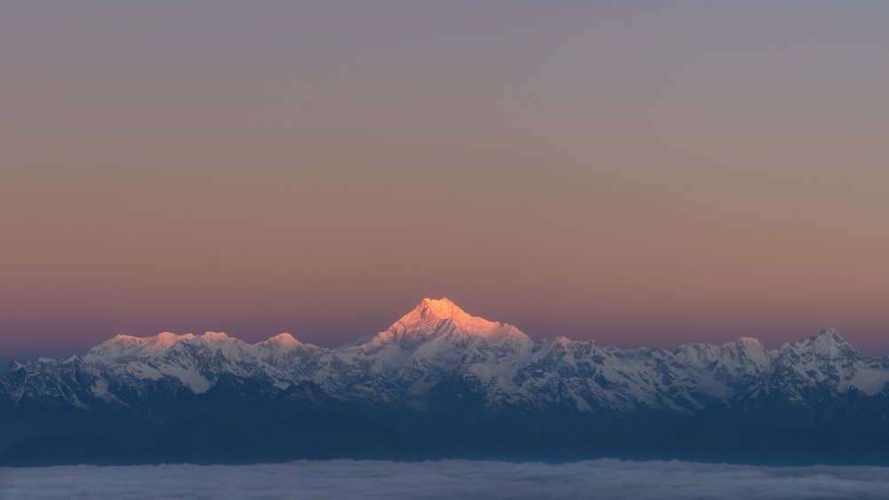 snow covered mountain during daytime