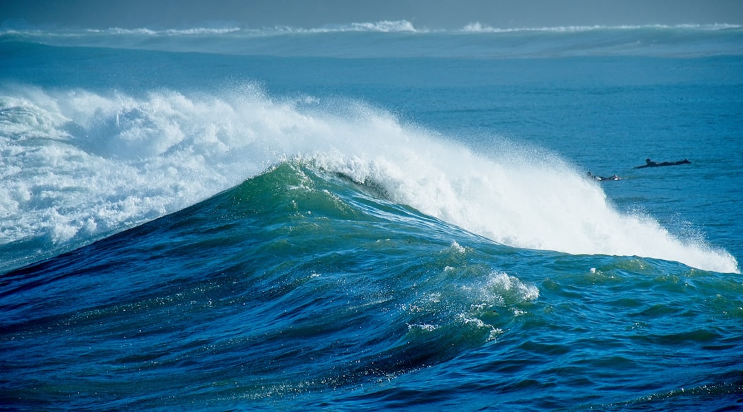 ocean waves under blue sky during daytime