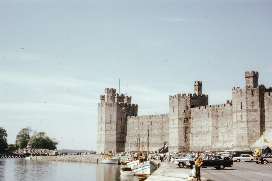 people walking on dock near brown concrete building during daytime