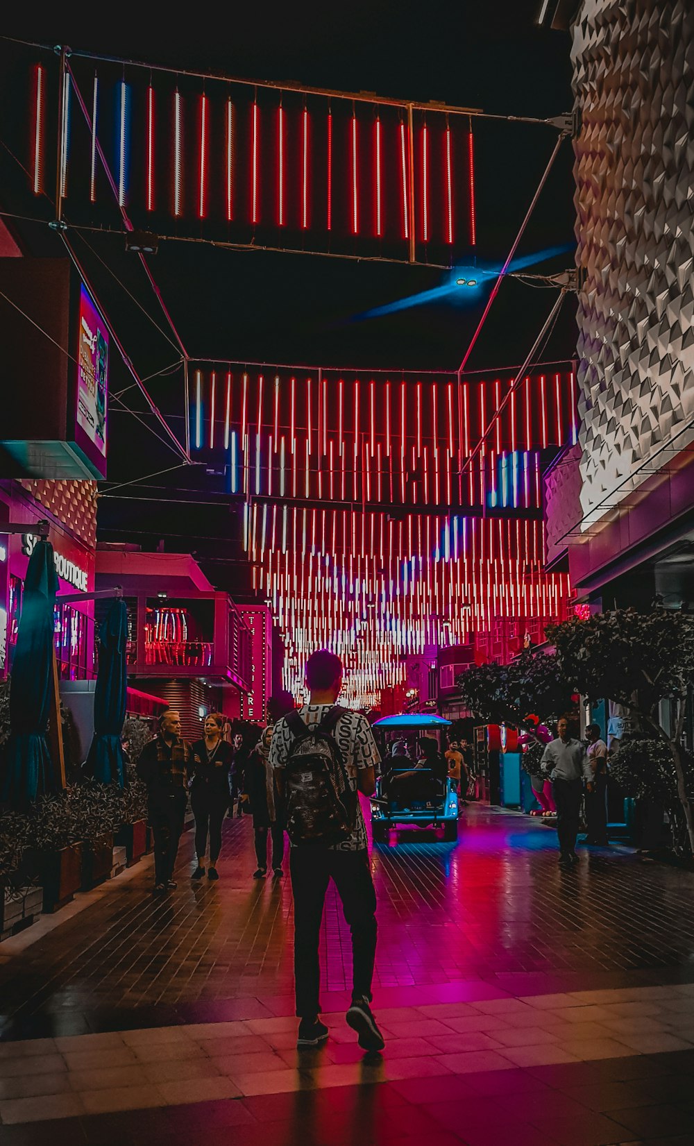 people walking on street during nighttime