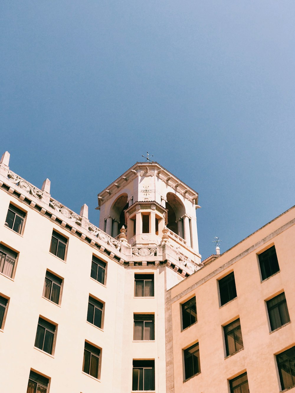 white concrete building under blue sky during daytime