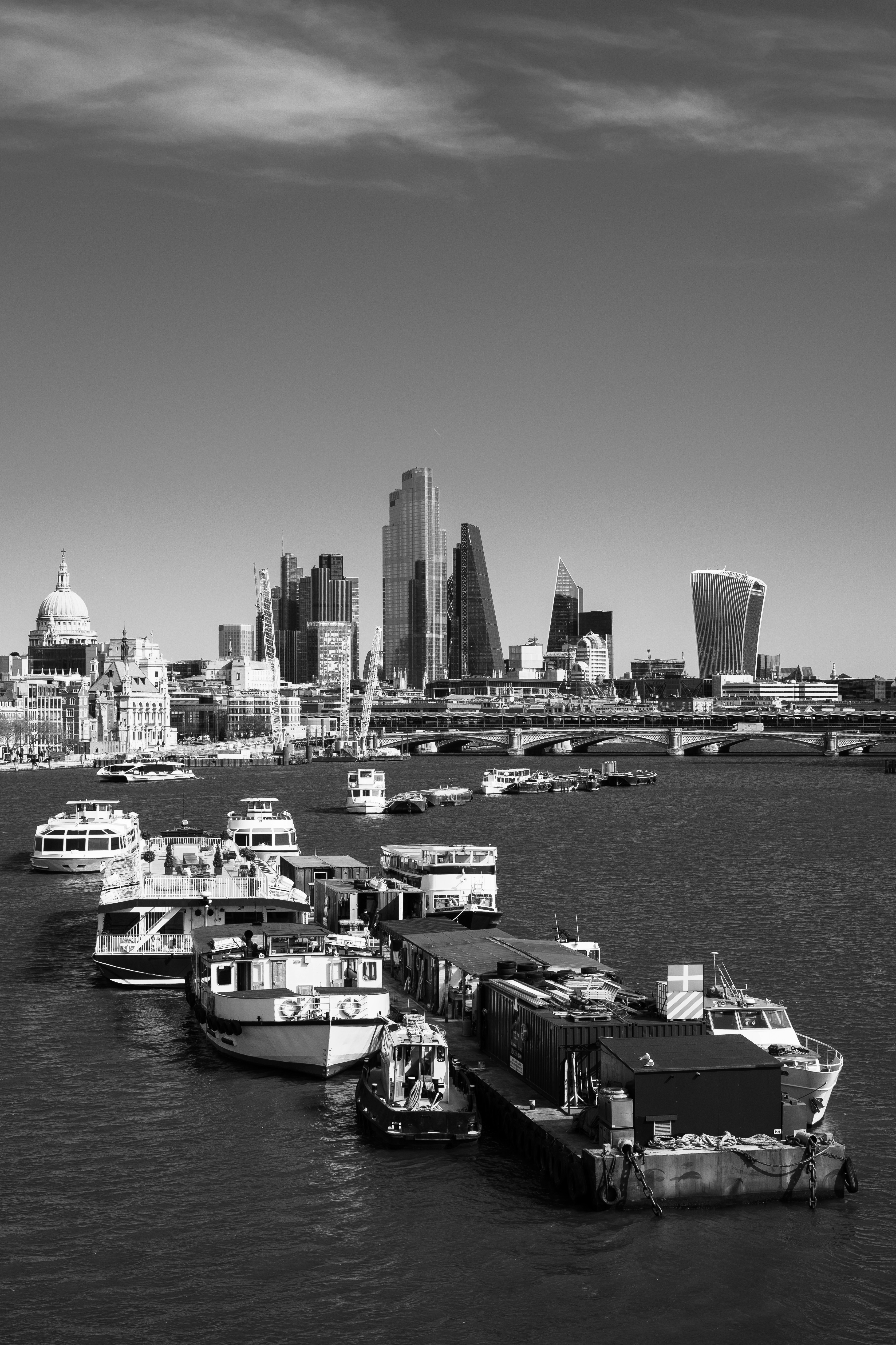 grayscale photo of city skyline during daytime