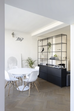 black wooden cabinet beside white table