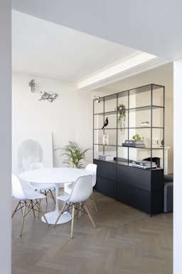 black wooden cabinet beside white table