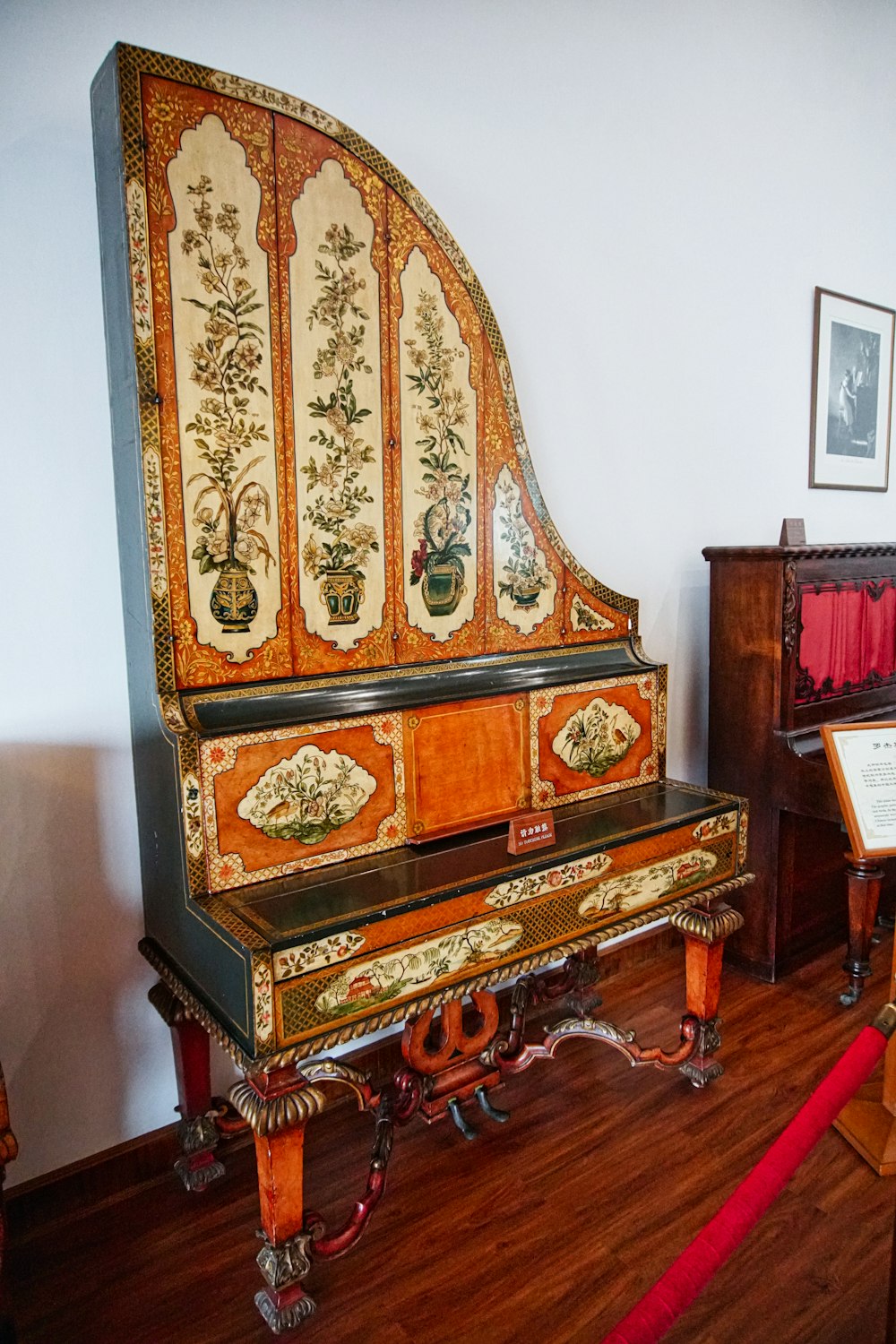 brown wooden upright piano beside white wall