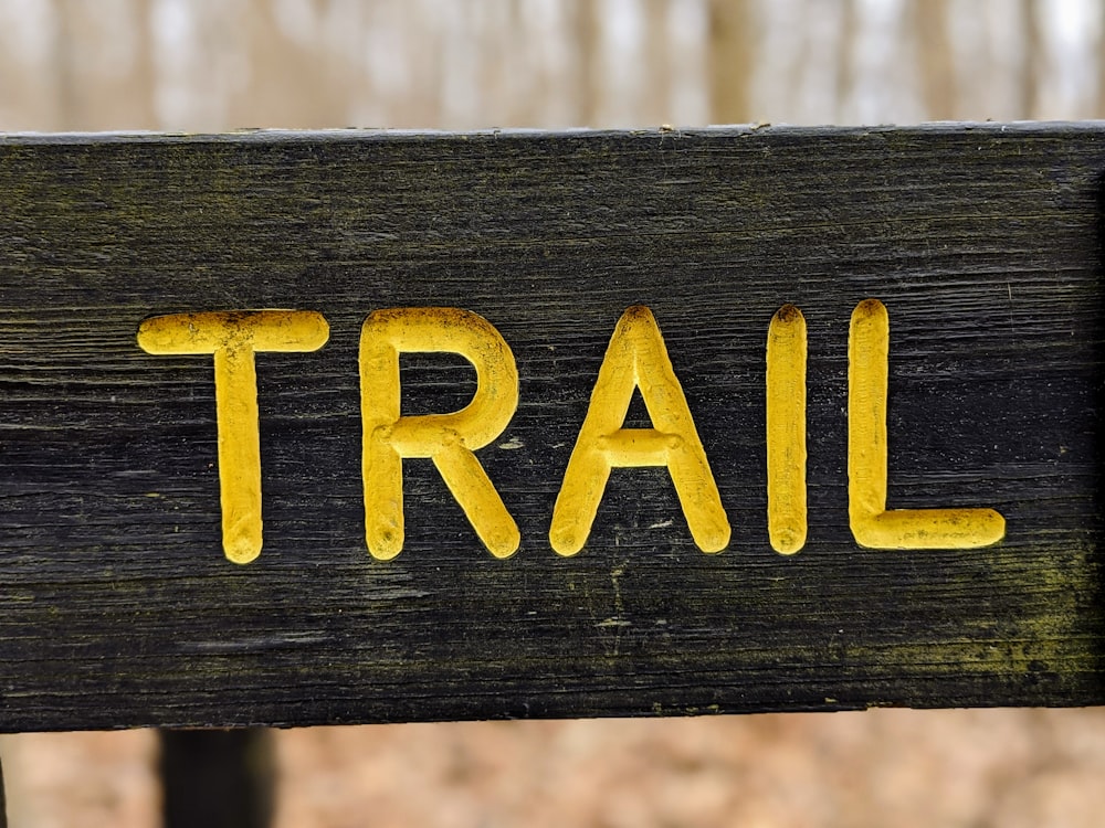 black and yellow wooden signage