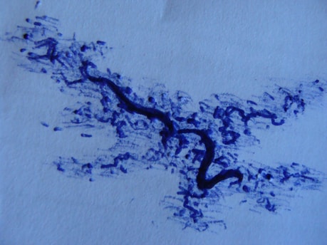 A blue abstract ink drawing on a white paper. It features a thick, meandering line at the center, surrounded by lighter, dispersed markings that may represent splatters or scribbles.
