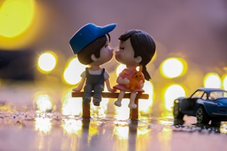 black haired girl in yellow and blue dress figurine