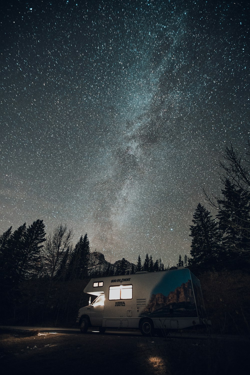 white and brown house under starry night