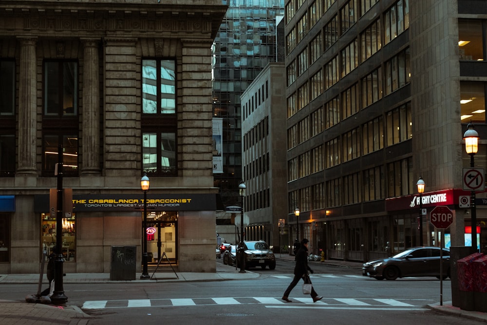 people walking on pedestrian lane near brown concrete building during daytime