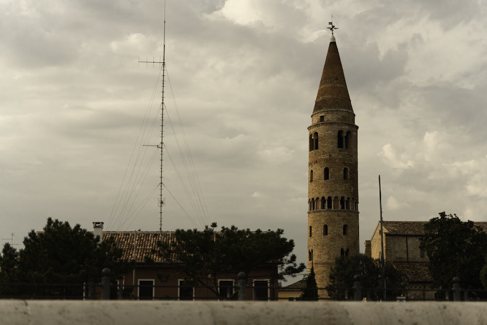 brown concrete building under white clouds during daytime