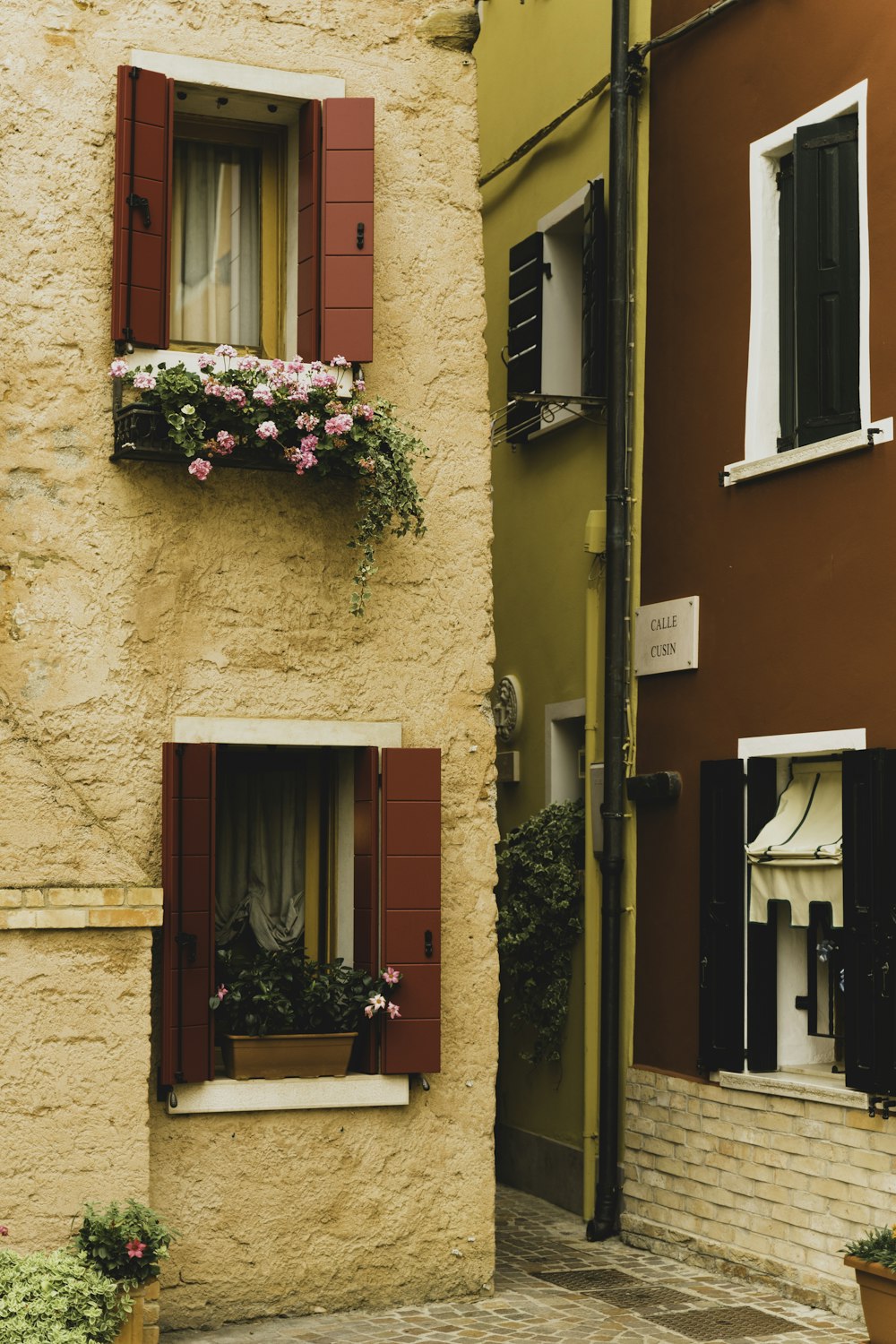 brown wooden door with pink and white flowers