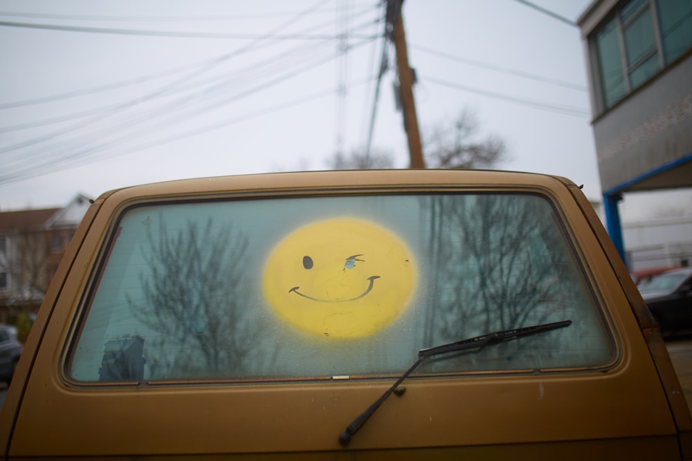 yellow and white car with yellow and black sun sticker