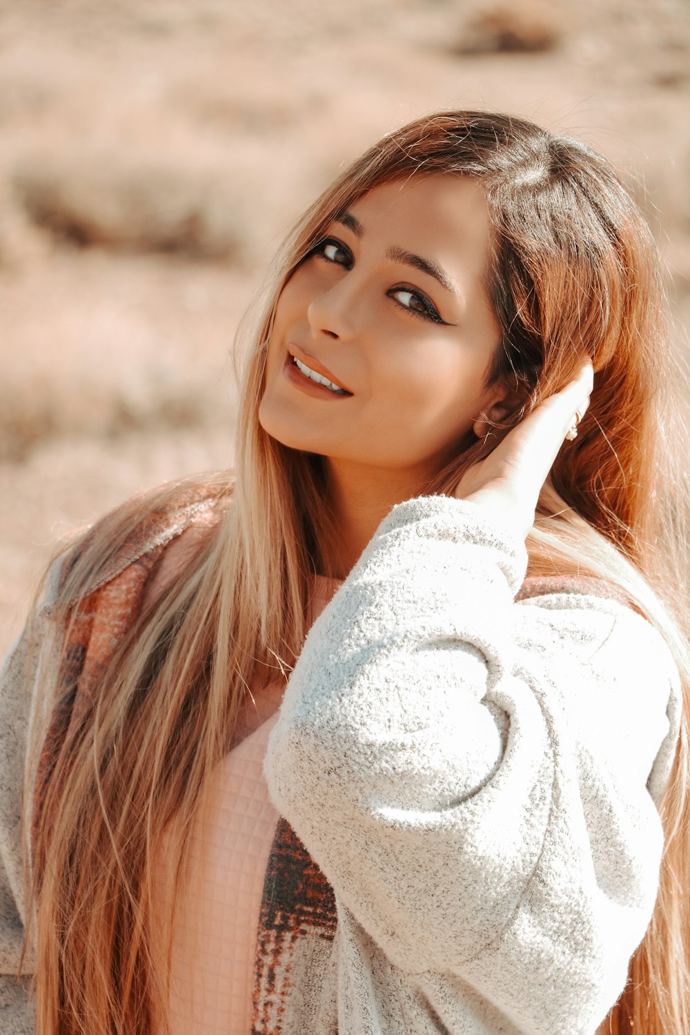 woman in white sweater smiling