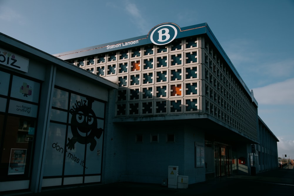 white and black concrete building under blue sky during daytime