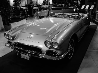 grayscale photo of mercedes benz convertible coupe