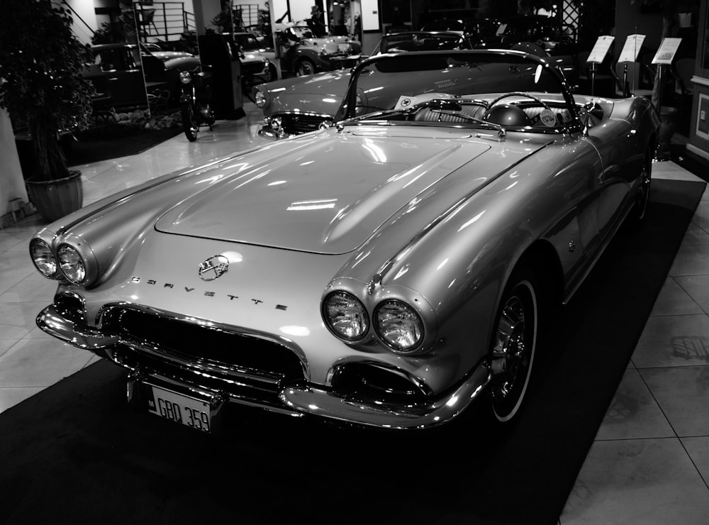 grayscale photo of mercedes benz convertible coupe