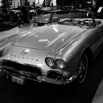 grayscale photo of mercedes benz convertible coupe