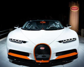 white porsche 911 parked near brown wooden post