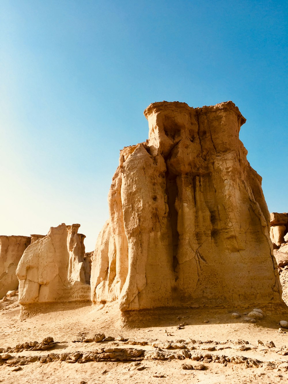 brown rock formation under blue sky during daytime